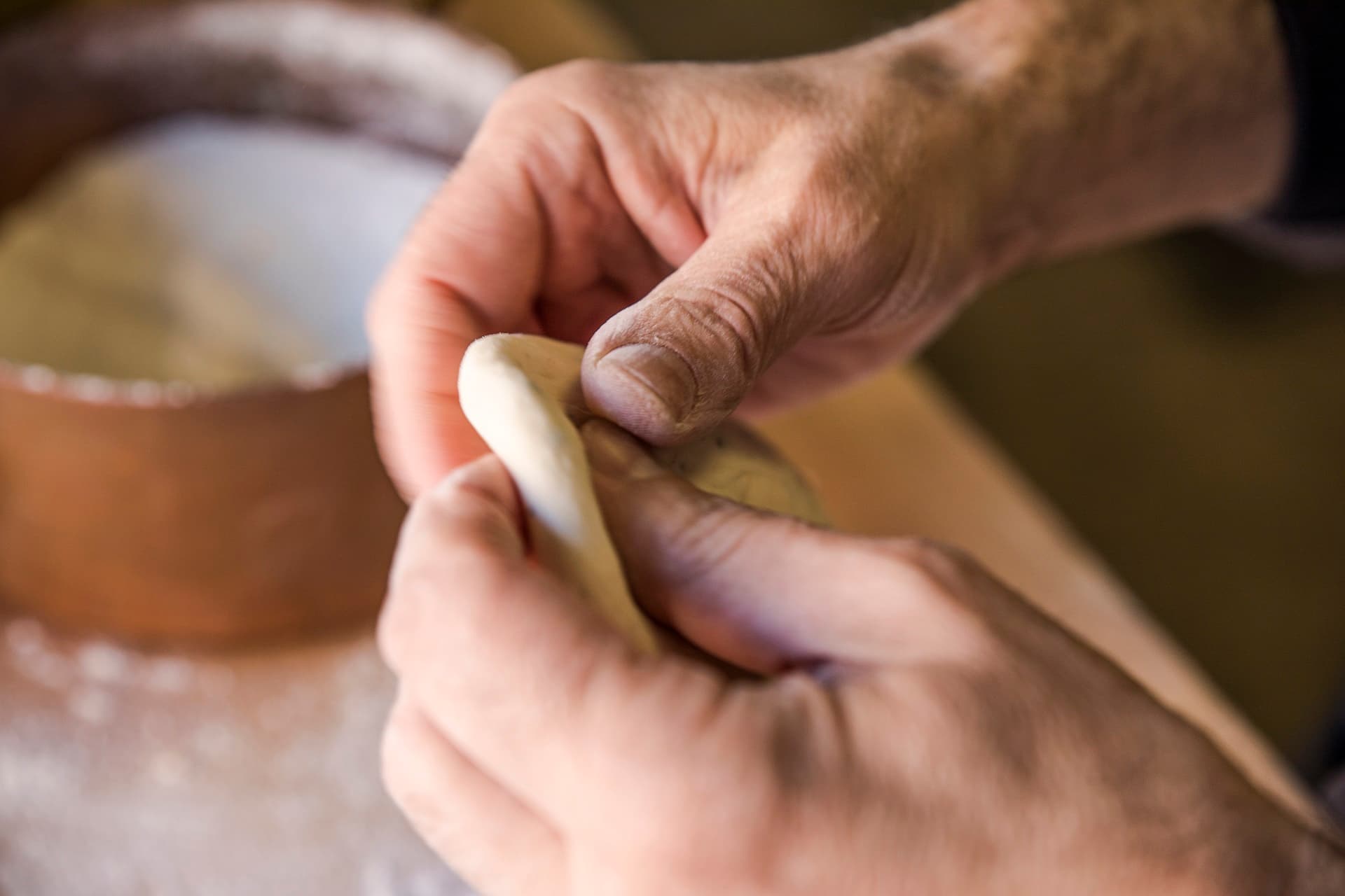 Pasta being shaped in the kitchen
